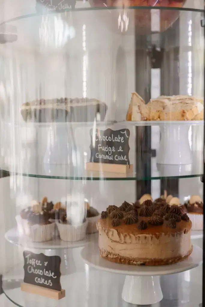 a cake display cabinet shows of the array of delicious looking cakes and sweet treats on offer to residents of Bolton's residential care home providers Starmount Villa