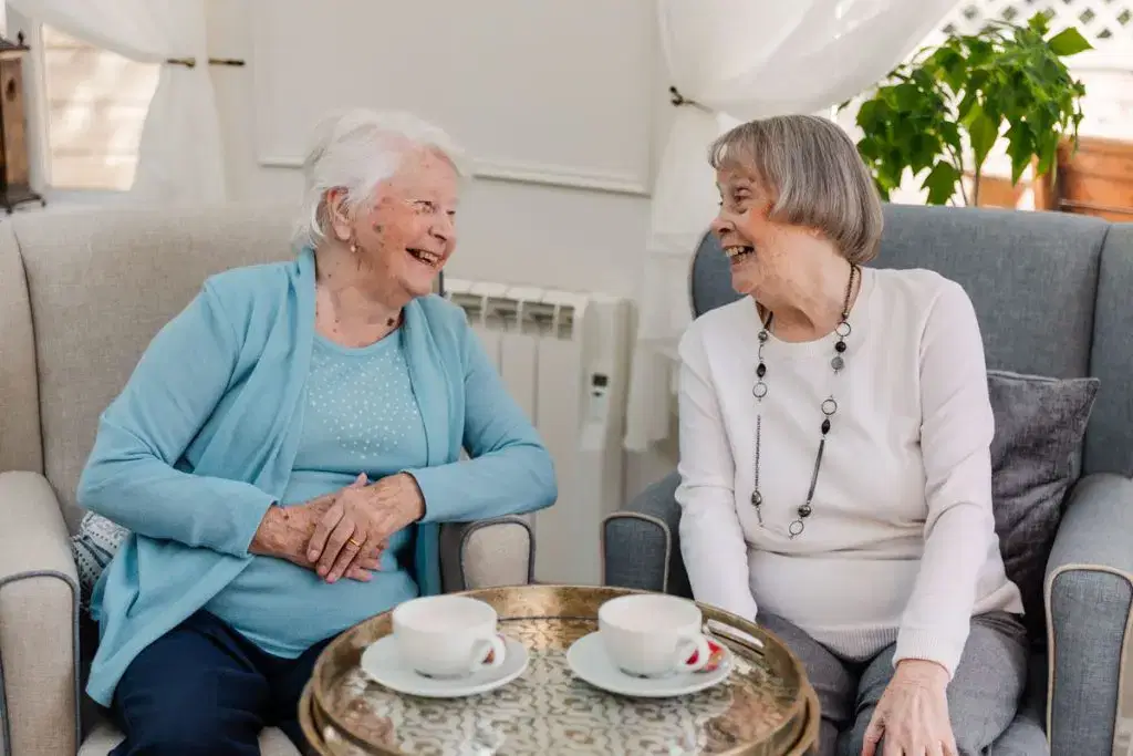 Residents of Starmount Villa, a residential care home community in Bolton, enjoy a chat and a cup of tea