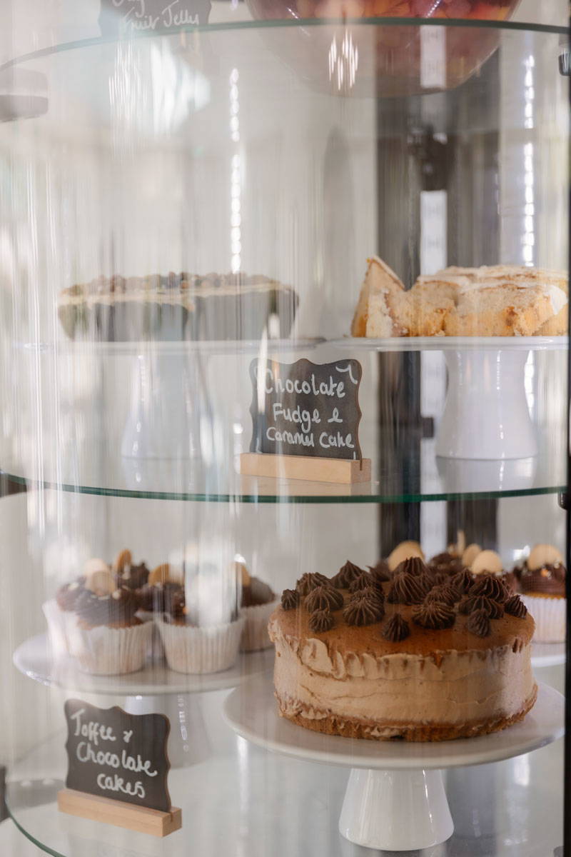 a cake display cabinet shows of the array of delicious looking cakes and sweet treats on offer to residents of Bolton's residential care home providers Starmount Villa